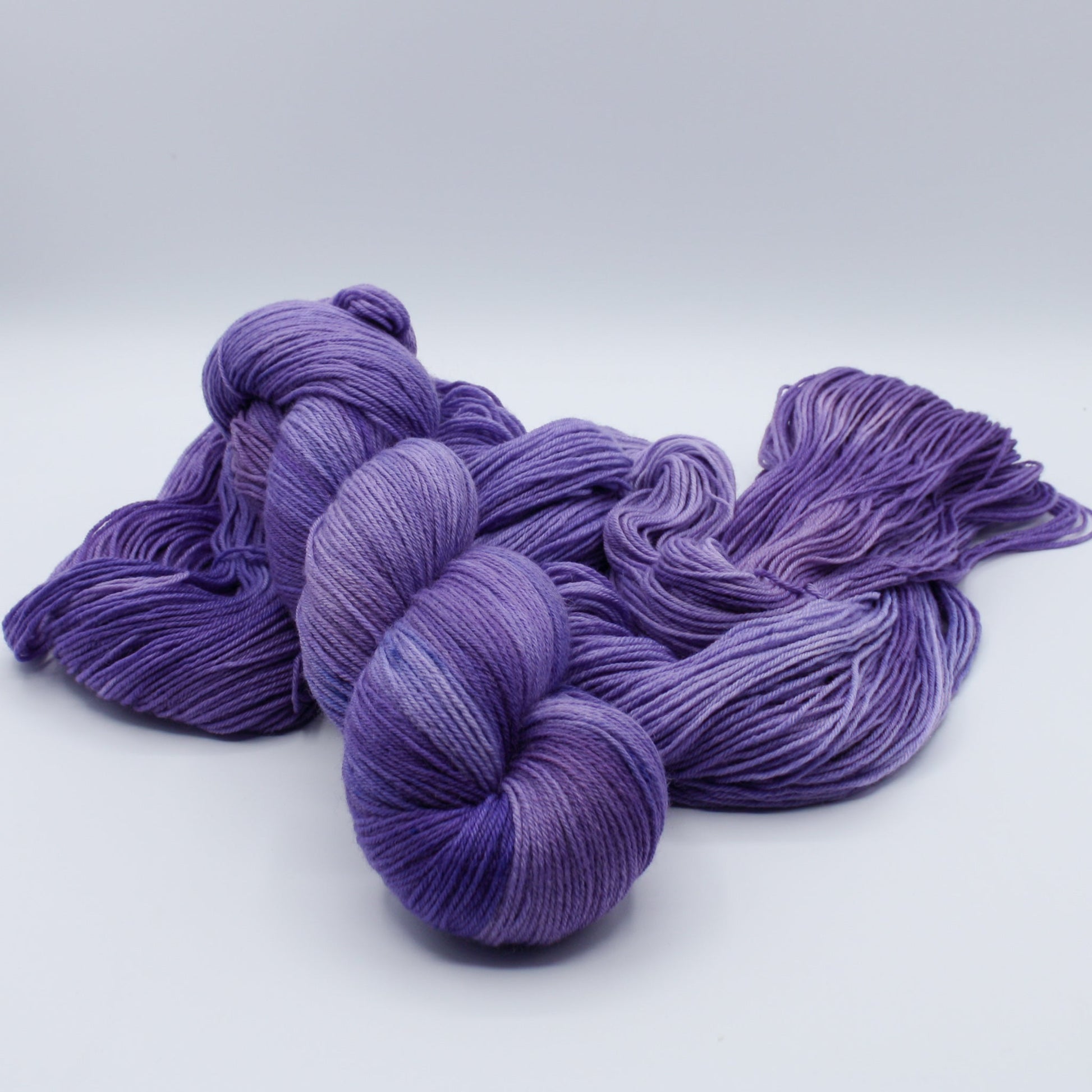 Quiet Amethyst hand dyed yarn by A Splash Of Fiber — artisan fiber and handmade creations